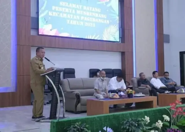 1643014162_871x497_copy_697x497 Camat Pagedangan, Akhmad Zainudin saat memberikan sambutannya di kegiatan Musrenbang 2023 di Kecamatan Pagedangan.